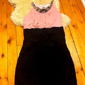 Sleeveless pink and black jewelled dress